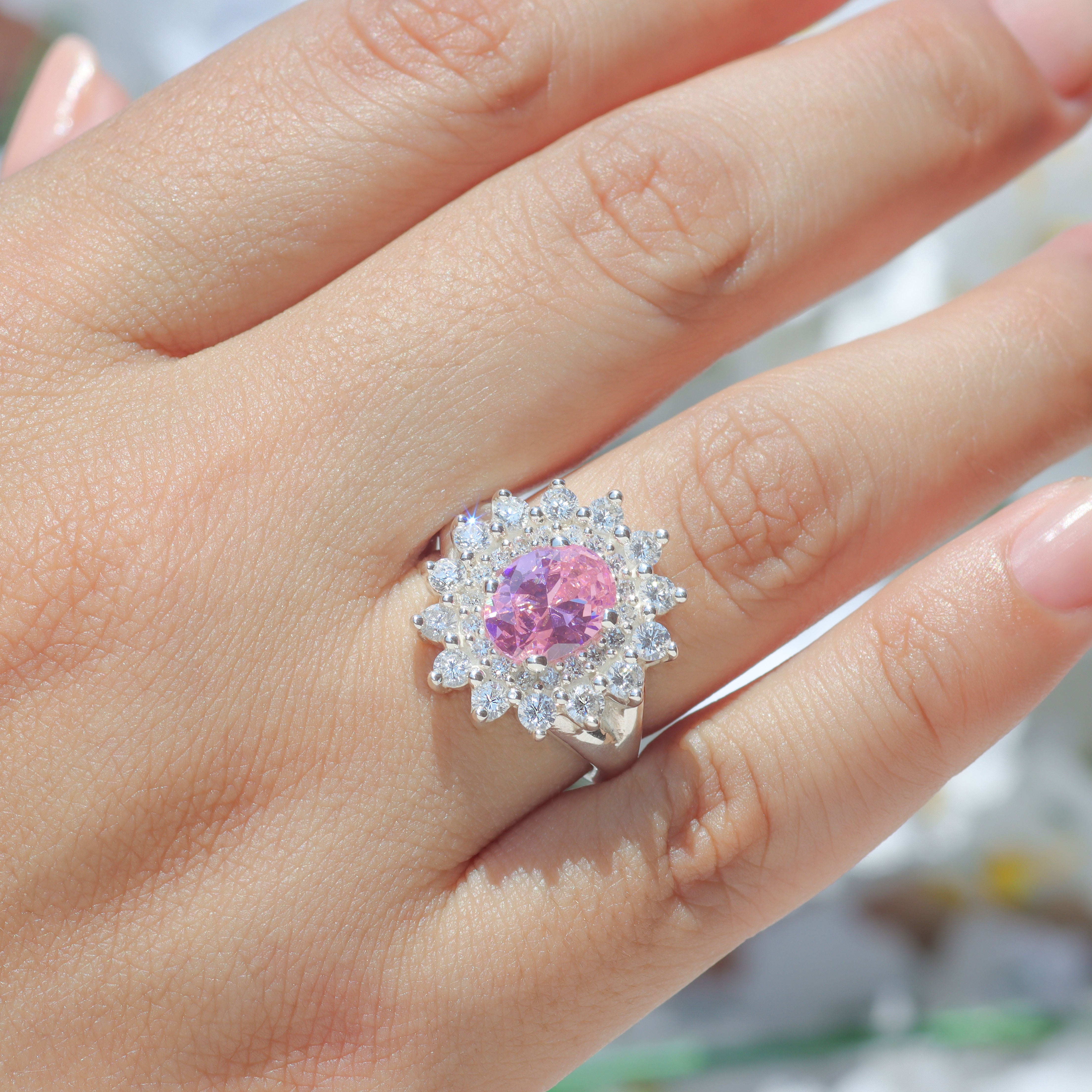 Rosette ring with oval center stone