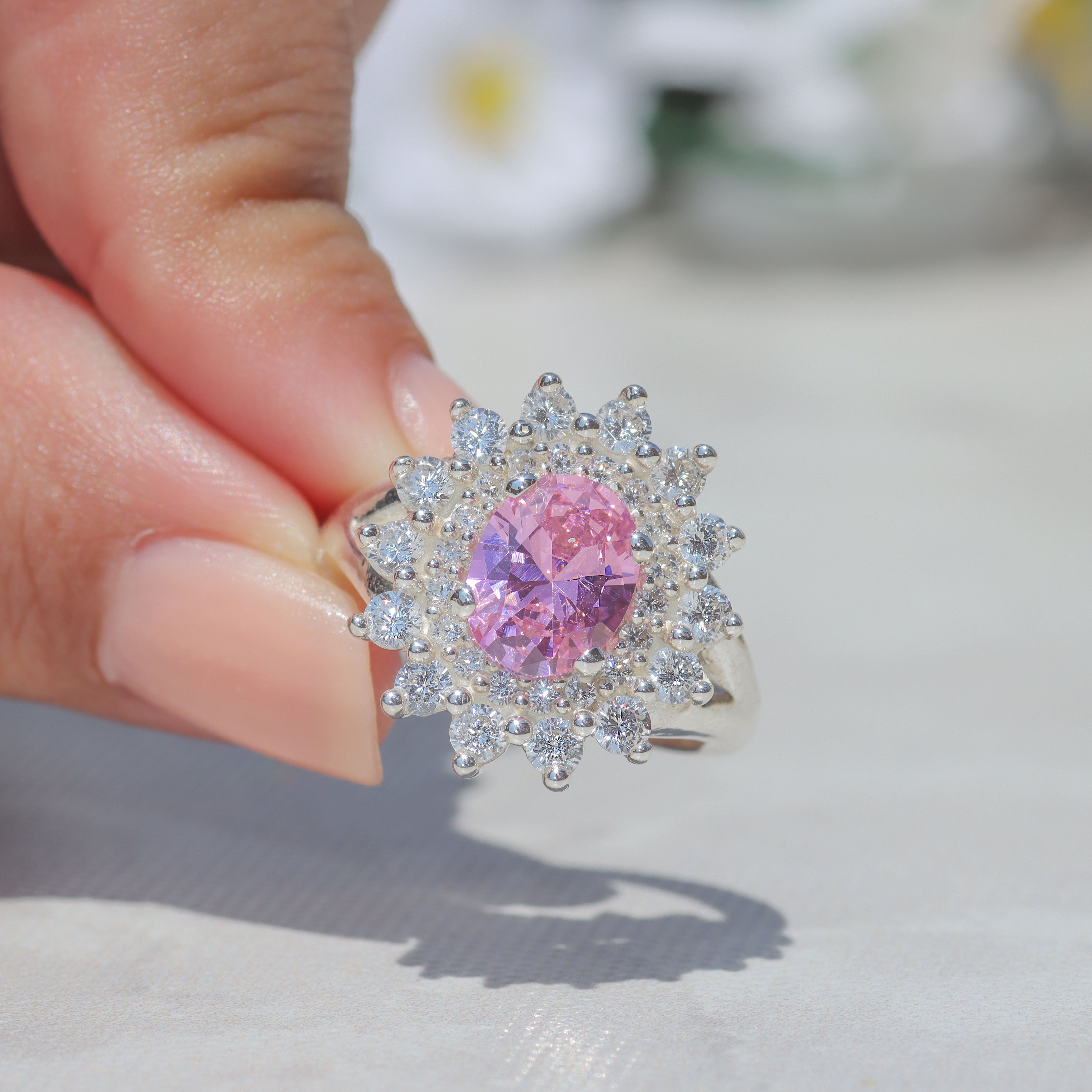Rosette ring with oval center stone