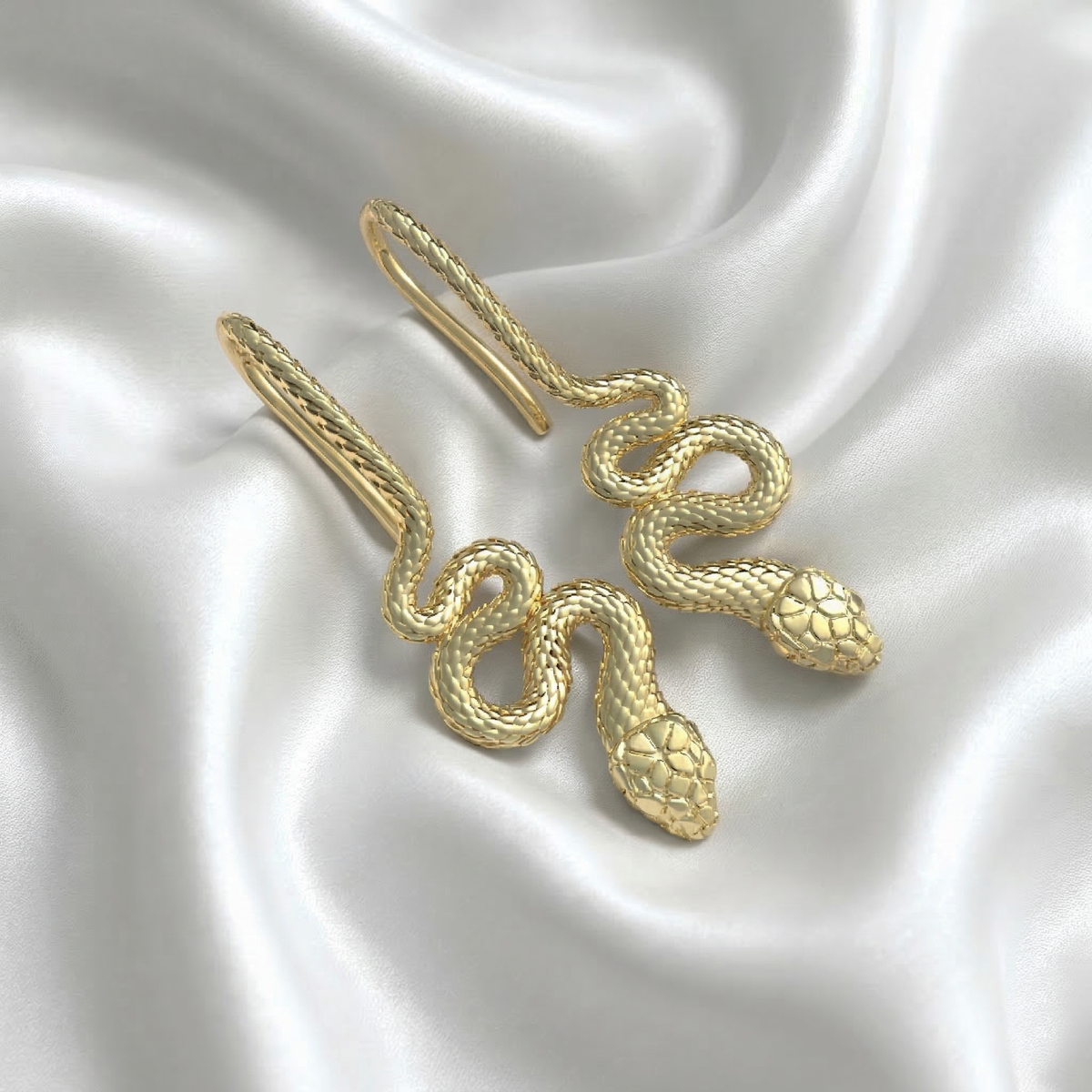 Aretes de serpiente en plata 950 y baño de oro 18k