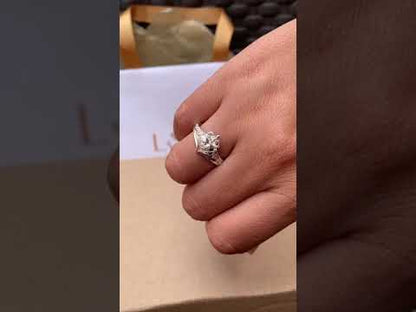 Anillo corazón con flor en plata 950