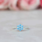 Anillo copo de nieve con piedras en plata 950