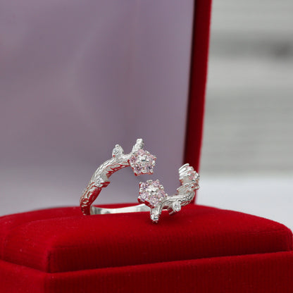 Anillo de flor y ramas con piedra en plata 950