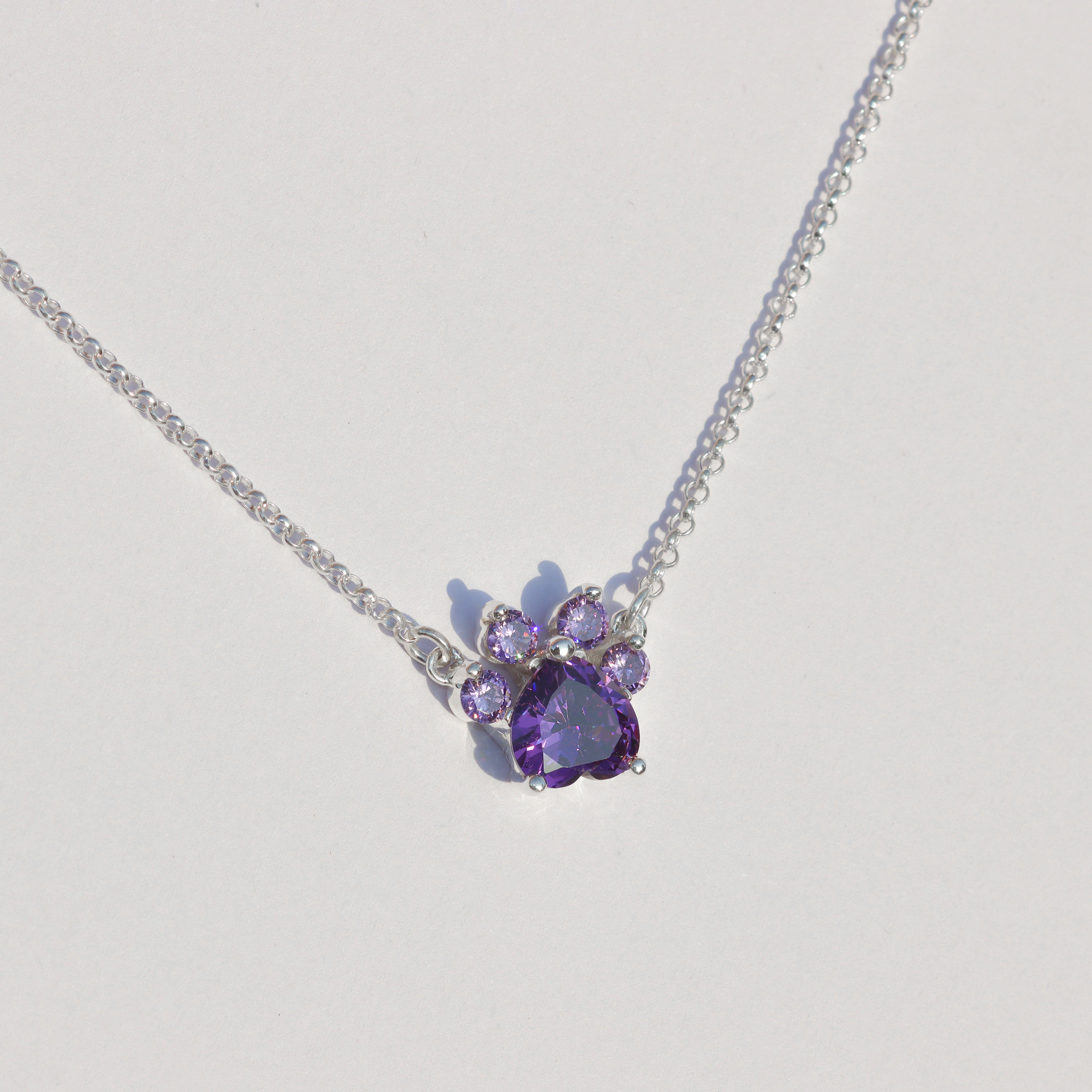 Paw print necklace with heart cut
