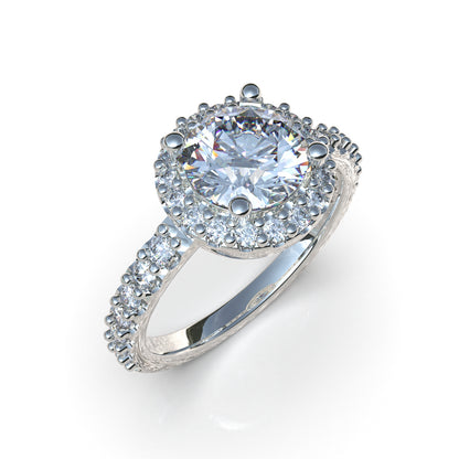 Anillo halo con piedra central en plata 950