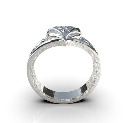 Anillo corazón con flor en plata 950